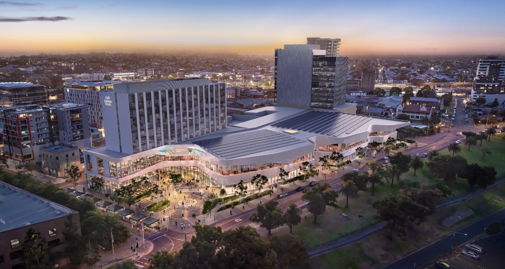 Artist impression of Geelong Convention and Exhibition Cenre from the air - displaying th Crowne Plaza tower and the exhibition centrea along the front, with the rrof covered in solar panels