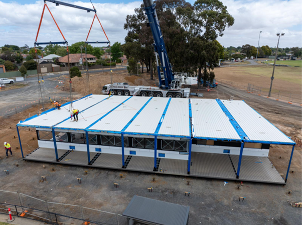 A picture of the new pavilion being assembled by workers at Frank Bourke Oval in Ballarat
