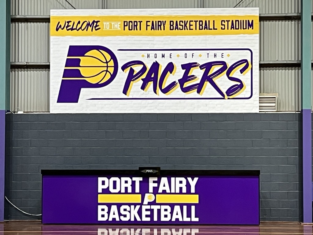 The Port Fairy Basketball Stadium was upgraded thanks to the Tiny Towns Fund. A wall with a welcome sign for the Port Fairy Basketball Stadium