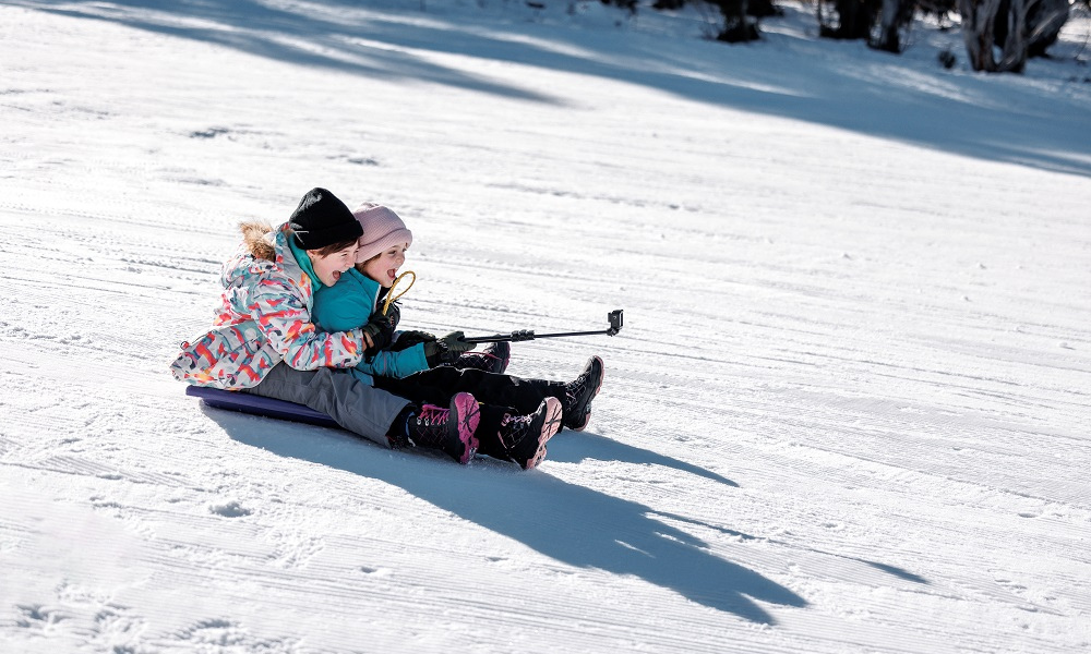Children on Toboggan slope at Dinner Plain