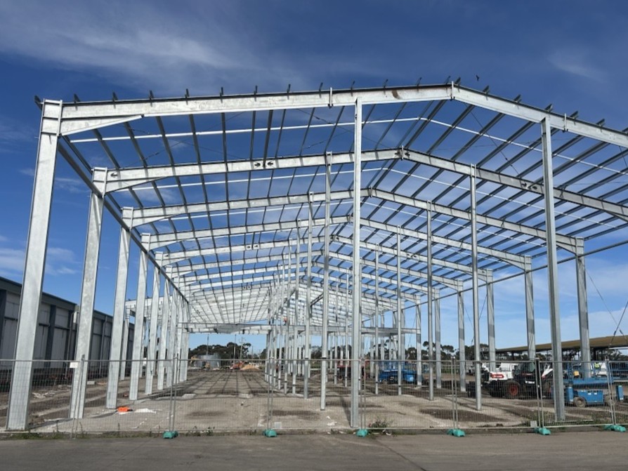 Construction is underway for M.C. Herd's expansion project. A metal building frame on a concrete slab