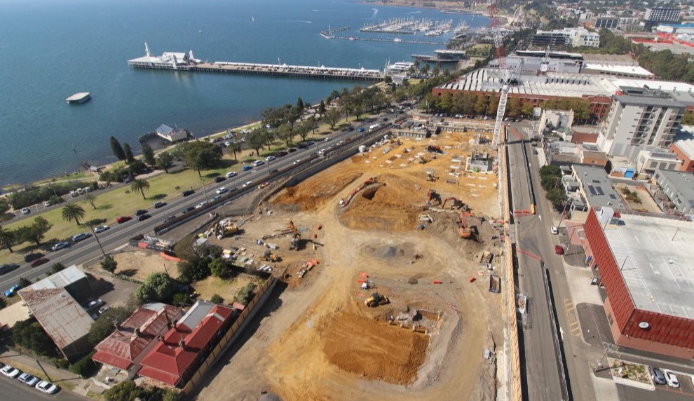 Aerial view of construction site along coastline.