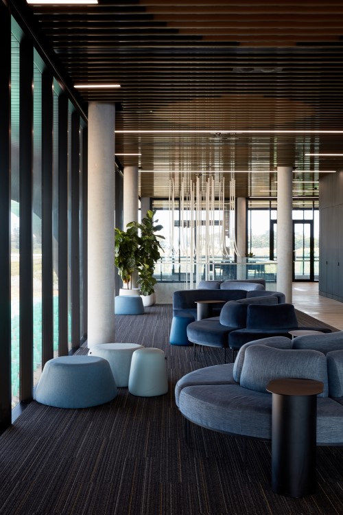 The new interior of the Ferry terminal, with velvet seating and atll glass windows with a soothing colour scheme