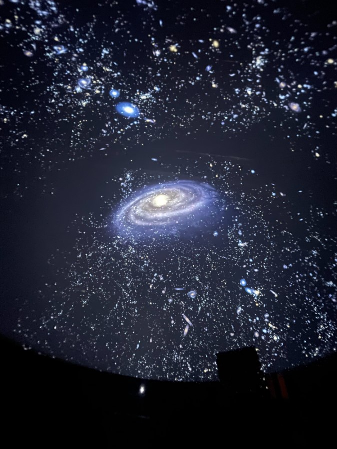 The entire Milky way galaxies is projected onto the dome, appearing as the night sky