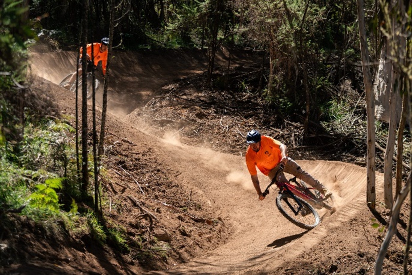 A person riding a bike on a dirt trail