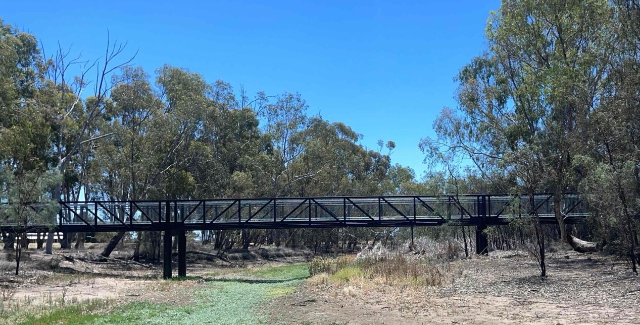 A picture of a new pedestrian bridge crossing the river