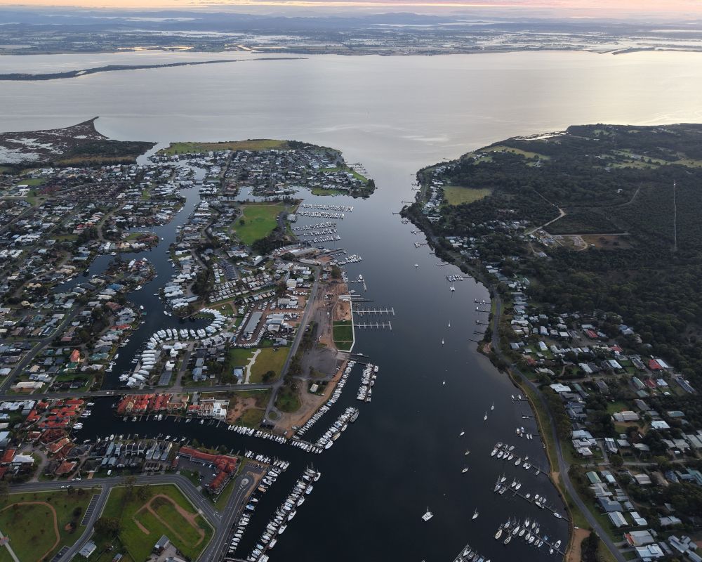 Birds eye view of the Slip Road Mariitme Precinct, showing ships at anchor and looking out over the waterway into the Gippsland Lakes.